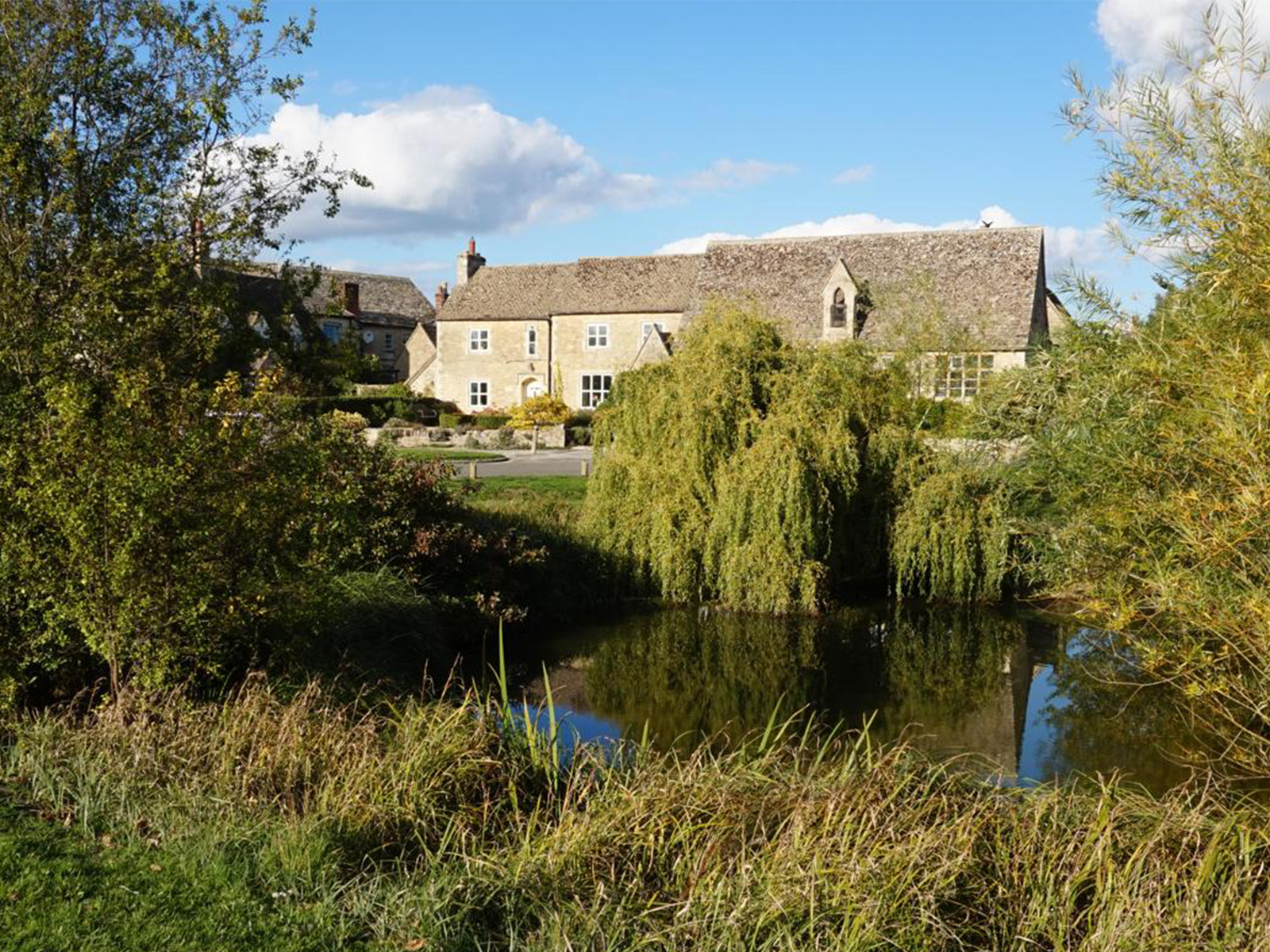 Pond and village scene